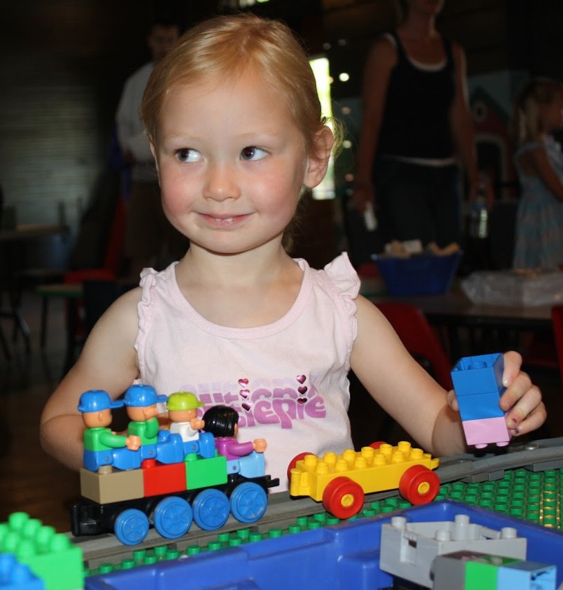 Young Grace helping with projects